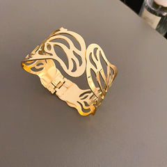 cutout flame cuff bracelet in polished gold – NYRIA