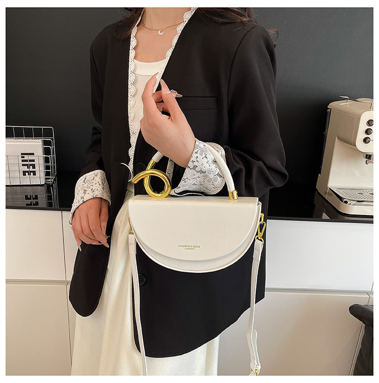 half-moon leather handbag with gold spiral handle – ORENA