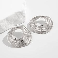 Textured open-circle earrings with sculptural ripples - Limali