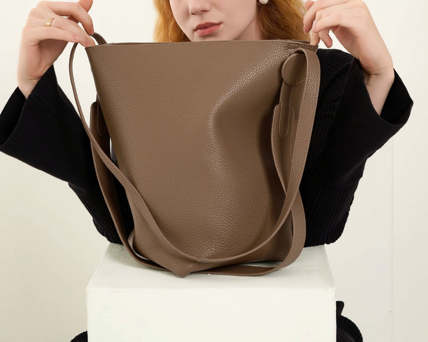 tall leather bucket bag with circular tab – OLIVE