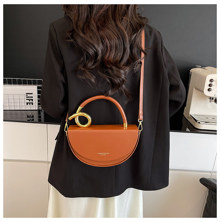 half-moon leather handbag with gold spiral handle – ORENA