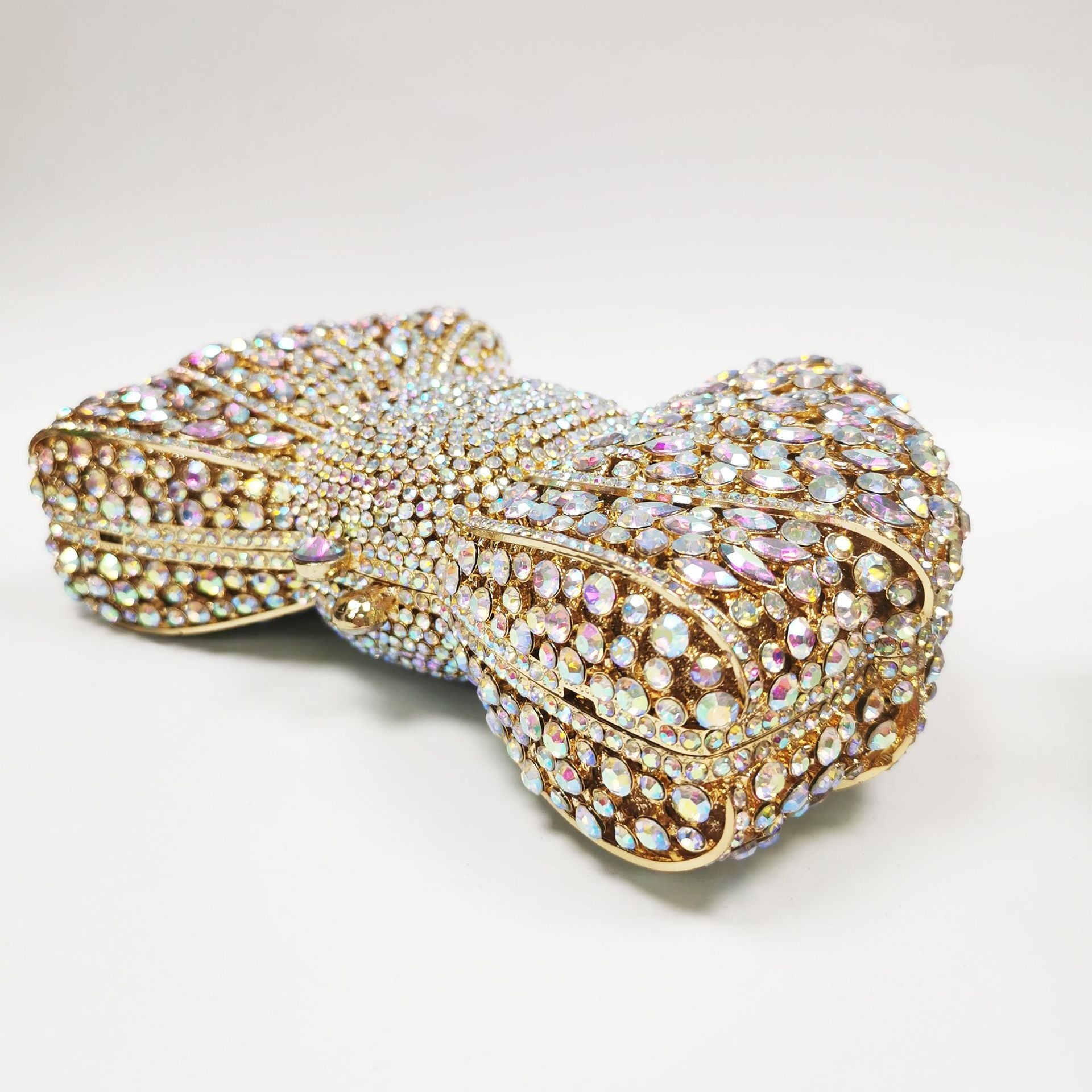 crystal bow-shaped clutch with emerald stones - Efrosini