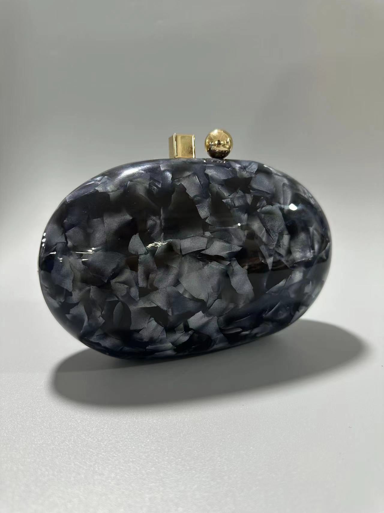 Oval marble clutch with gold clasp and chain handle - Zigru