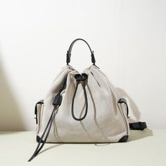 striped canvas drawstring bucket bag with leather trims – NOIIR