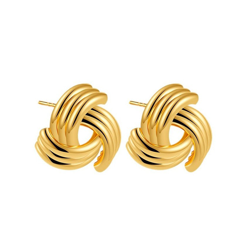 Ribbed twisted knot stud earrings in gold finish - Niguty