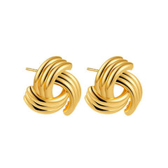 Ribbed twisted knot stud earrings in gold finish - Niguty