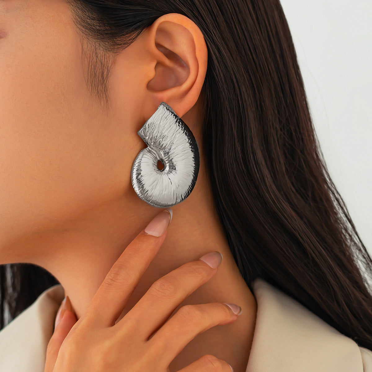 Sculptural spiral stud earrings with glossy texture - Vrtoni