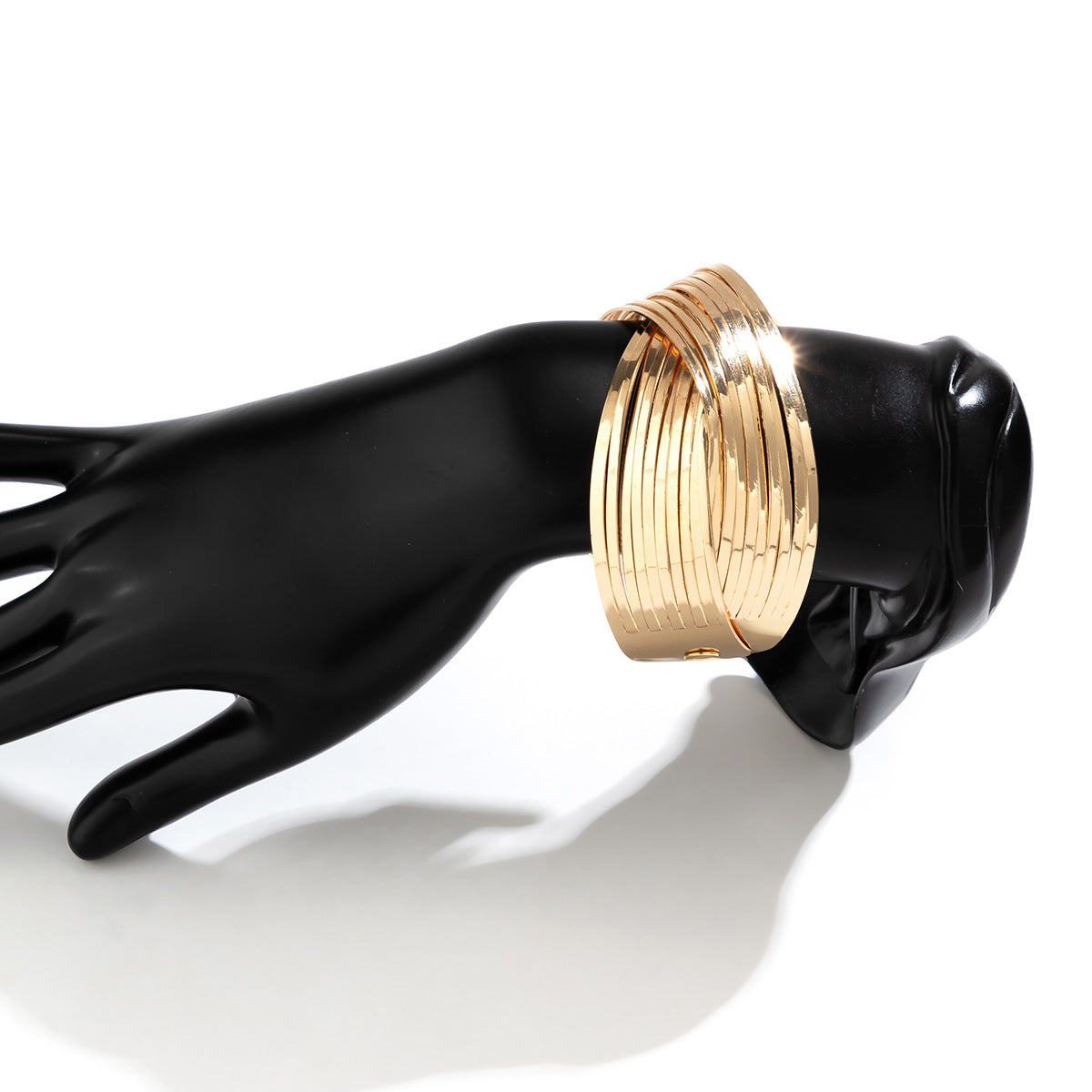 layered gold cuff bracelet with twisted band design – SEREIA