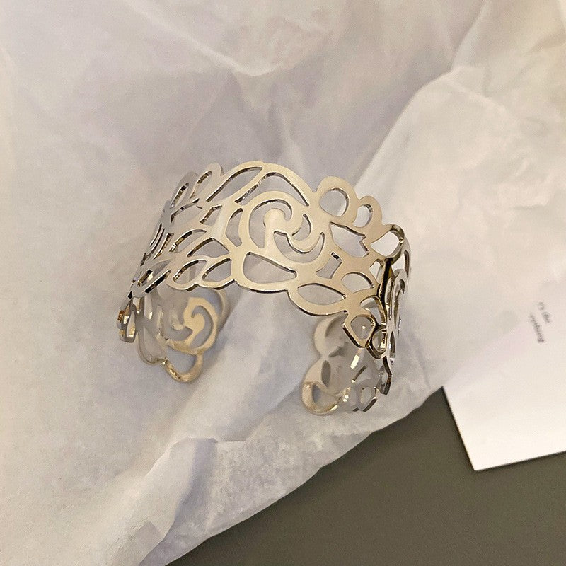 cutout flame cuff bracelet in polished gold – NYRIA