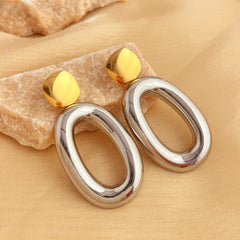 Two-tone geometric drop earrings with open oval detail – Nisdy