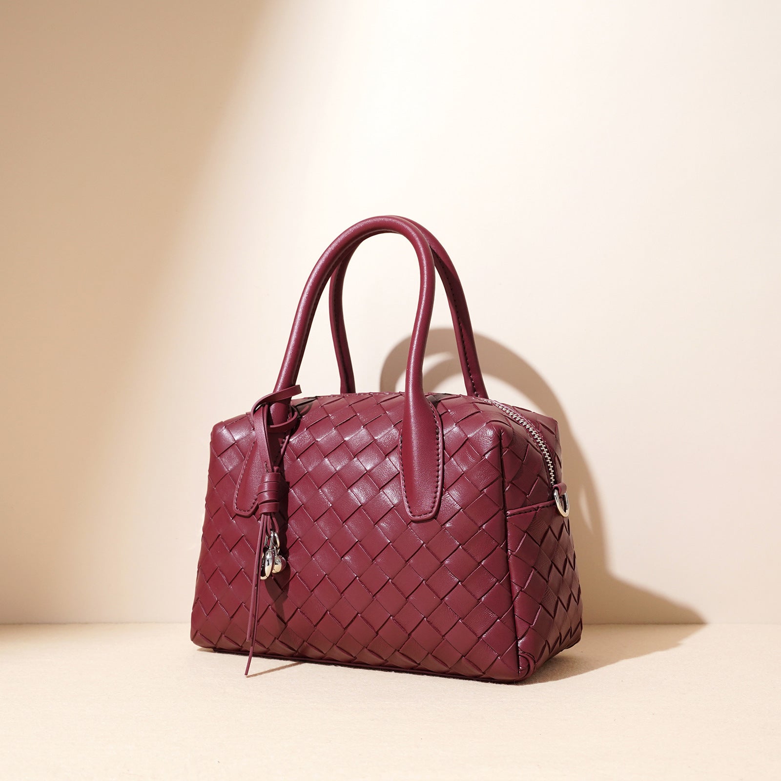 woven leather bowling bag with charm detail - ELENCA