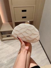Pearl-embellished clutch with gold clasp - Ikliru