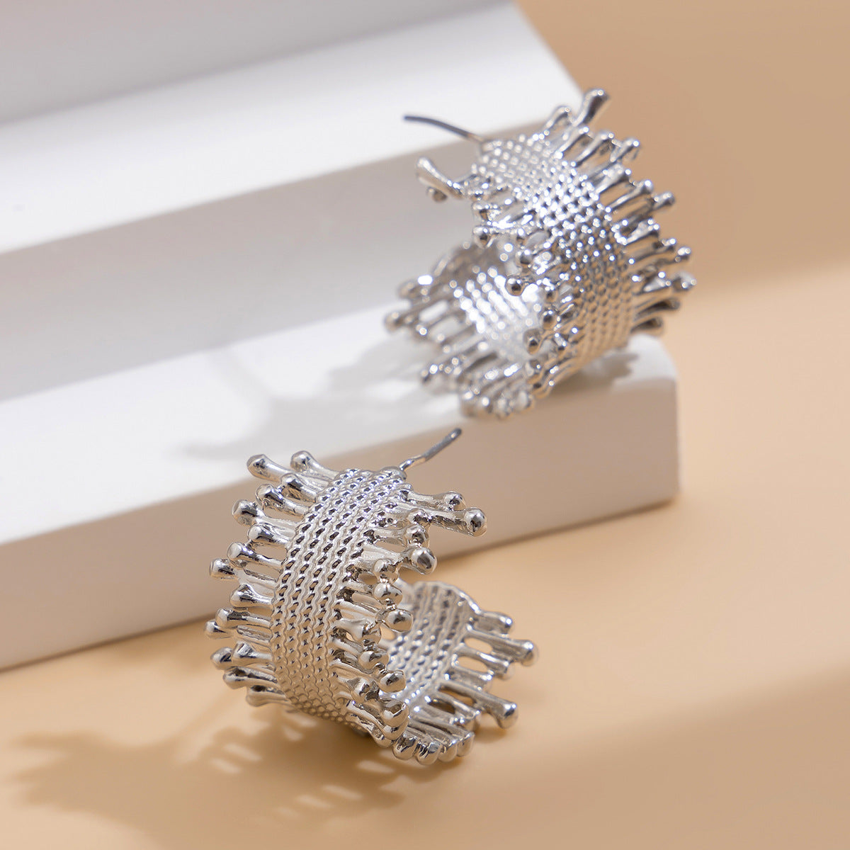 Textured woven hoop earrings with abstract tips – Nasdol