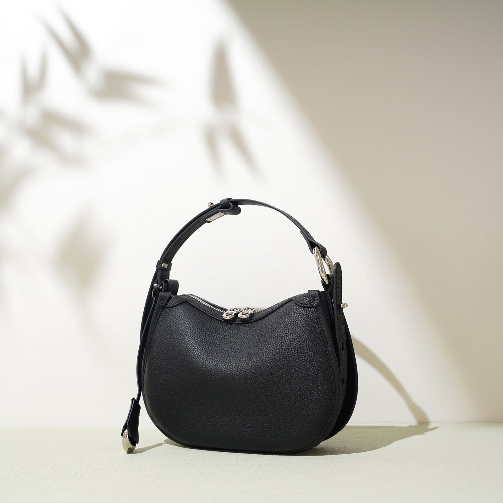 textured leather crescent bag with top handle - LAYLONA