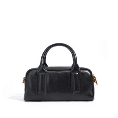 Structured top-handle handbag with bold strap detailing - LUNCA