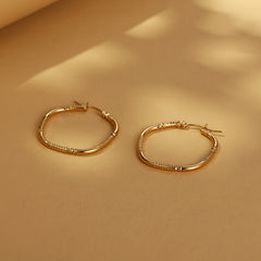 Gold-tone square hoop earrings with engraved detail - Zonzi