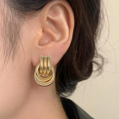 Twisted rope hoop earrings with interlocking loops – Nilker