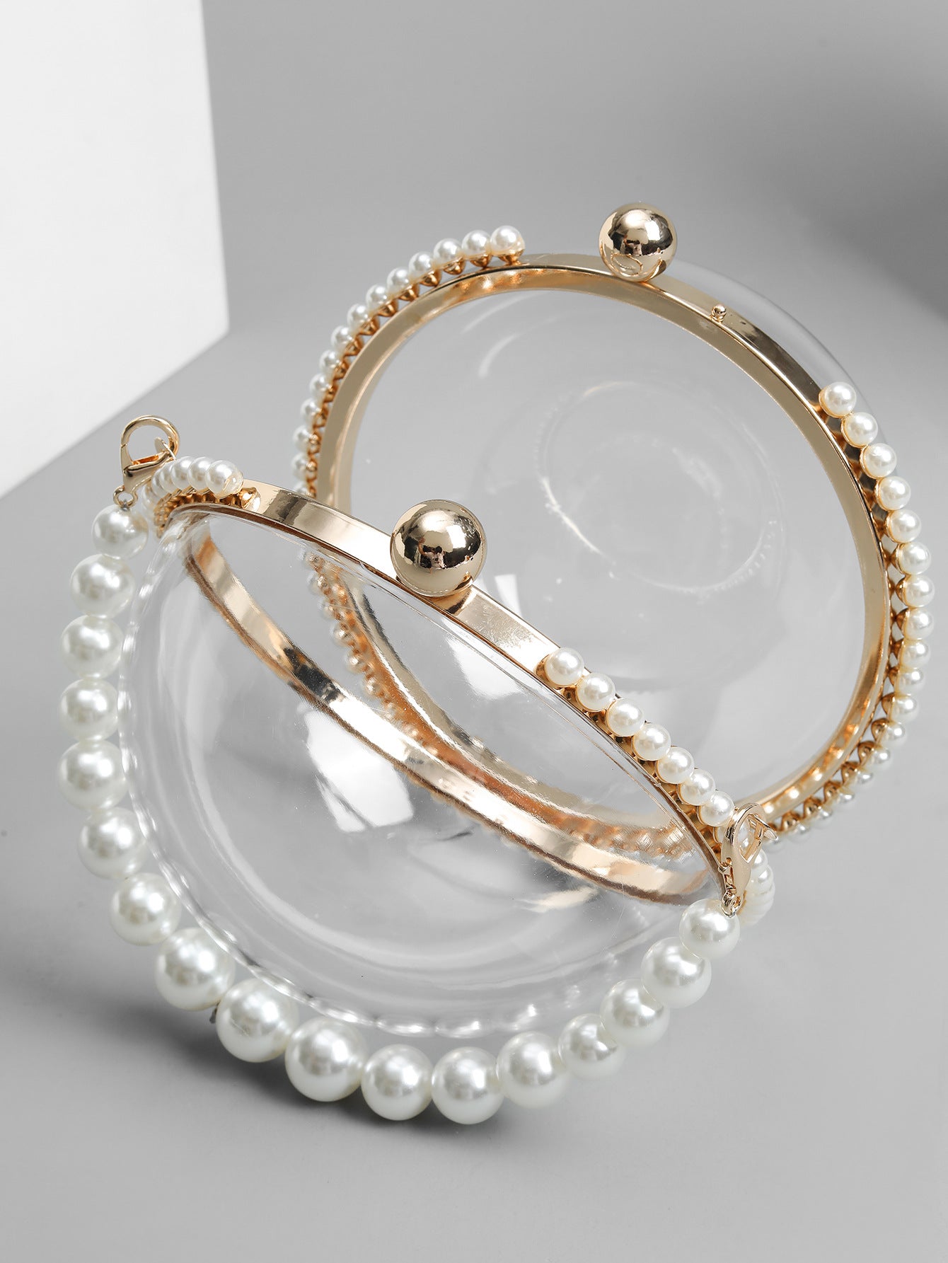 Circular clear bag with pearl handle and rhinestone accents - Lildu