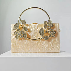 Geometric structured clutch with floral embellishments - Hirlu