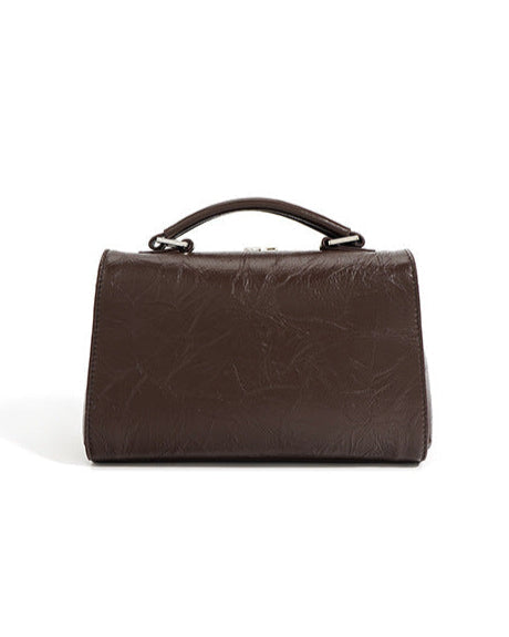 structured trapeze handbag with front patch pocket - NOXIR