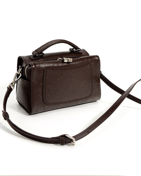 structured trapeze handbag with front patch pocket - NOXIR