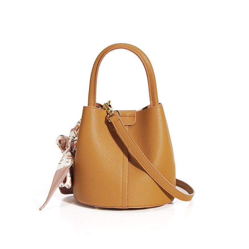 pebble-textured bucket bag with printed scarf detail - NORPA
