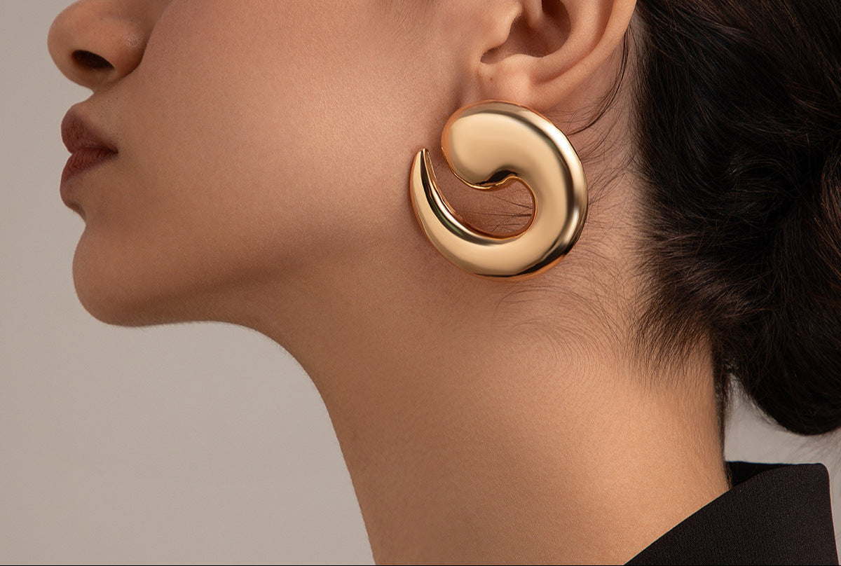 Swirl-shaped stud earrings with glossy finish - Tondi