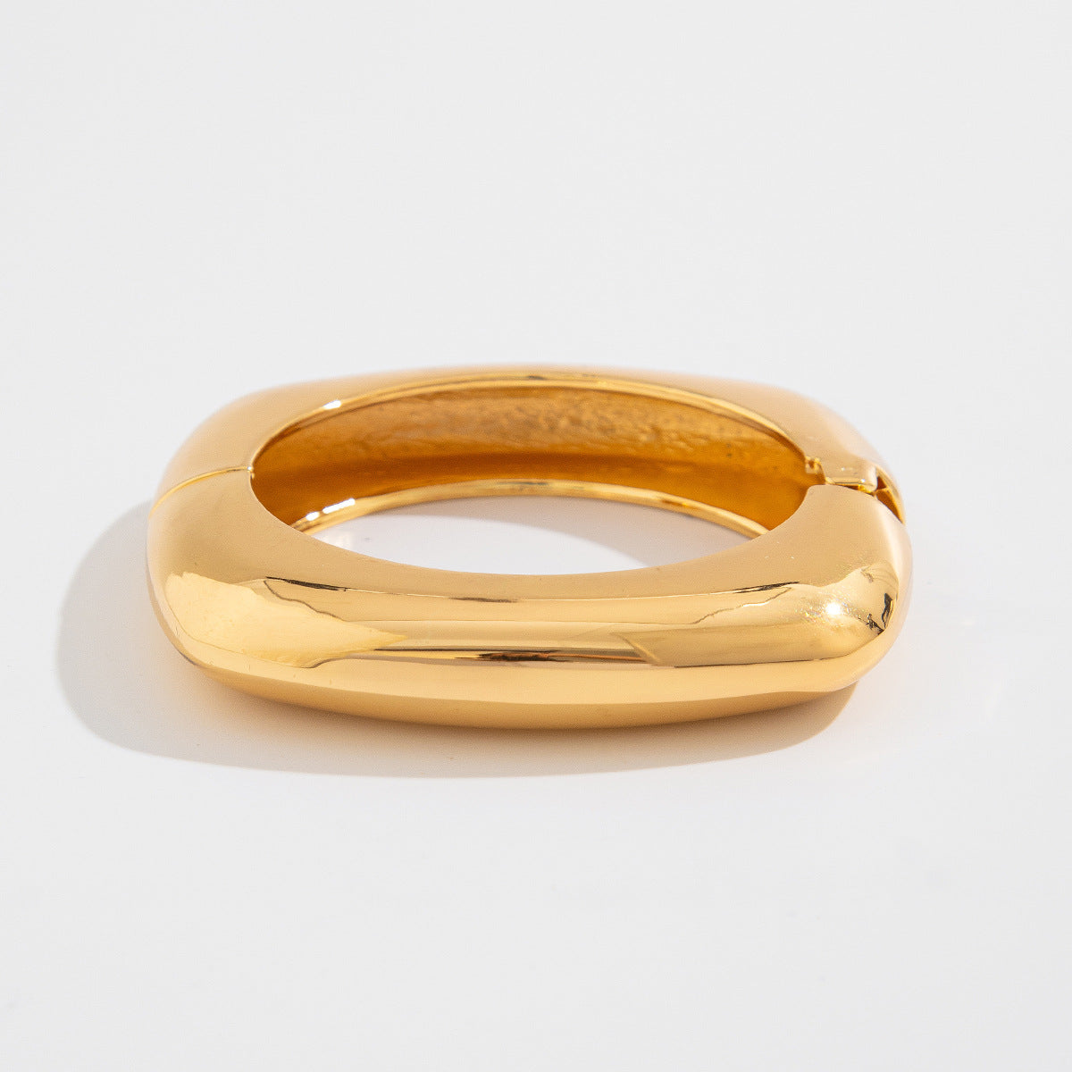 wide sculpted cuff bracelet in high-shine gold – NOVARA