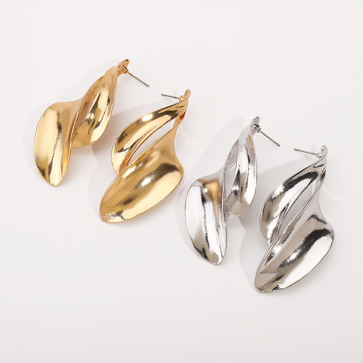 fluid wave drop earrings in polished gold – LUMINA