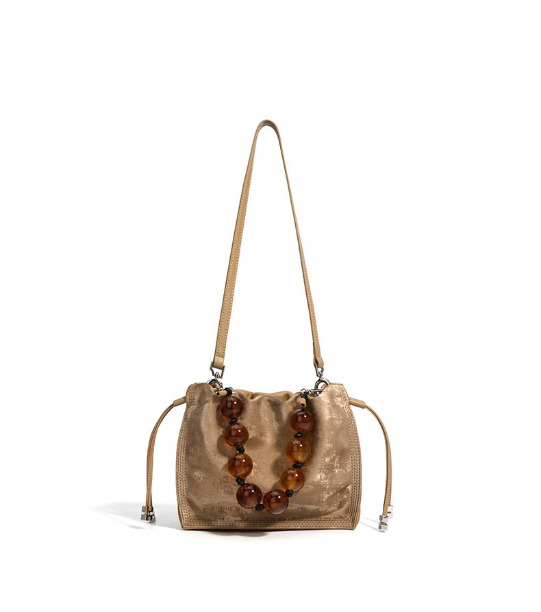 metallic drawstring shoulder bag with pearl handle – OLIVE