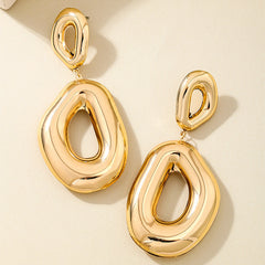 Bold molten drop earring with open center – Zindu