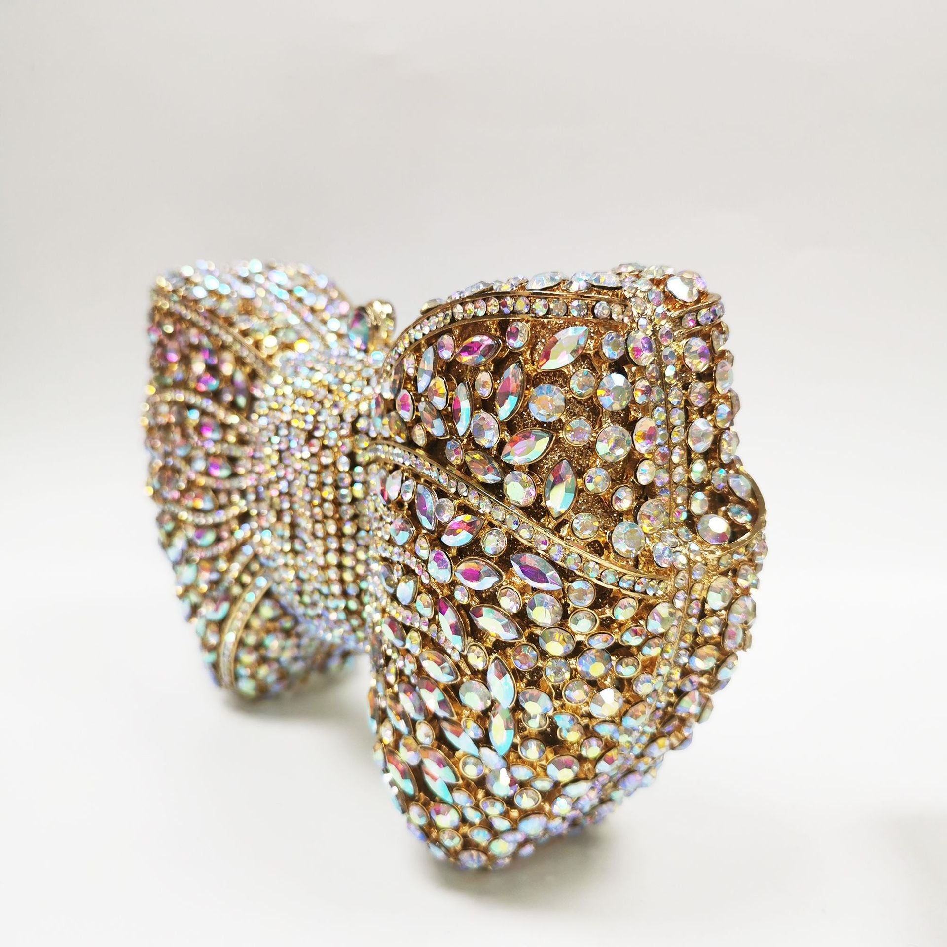 crystal bow-shaped clutch with emerald stones - Efrosini