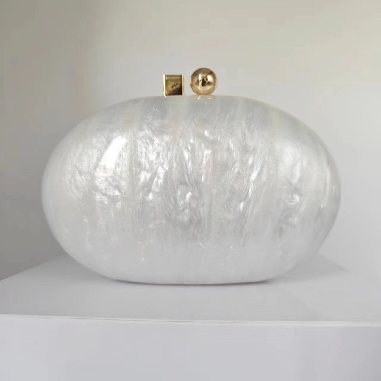 Oval marble clutch with gold clasp and chain handle - Zigru