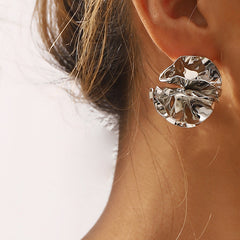 round folded metal stud earrings with embossed detail - ORAD