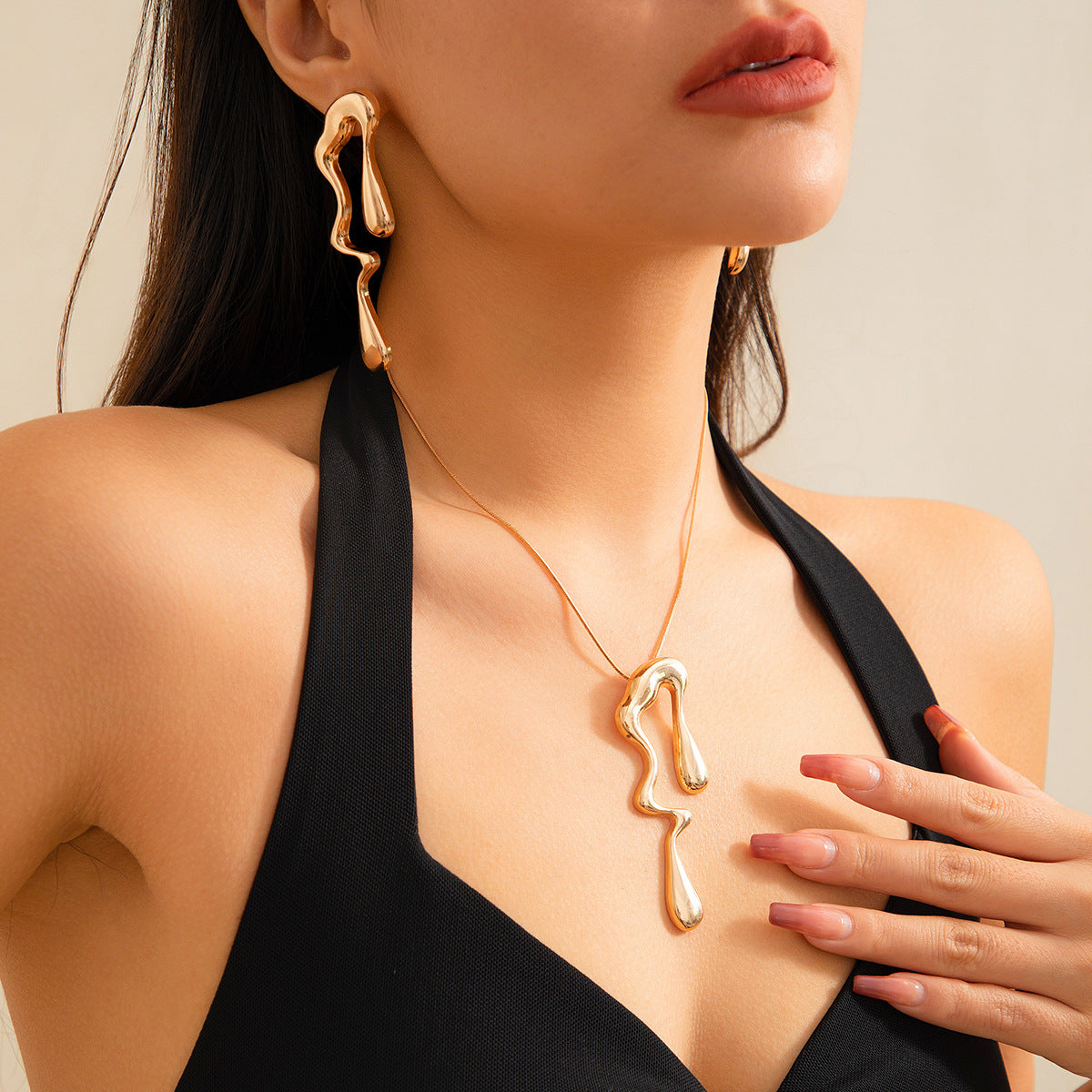 Asymmetric melted metal drop earrings - Nandi