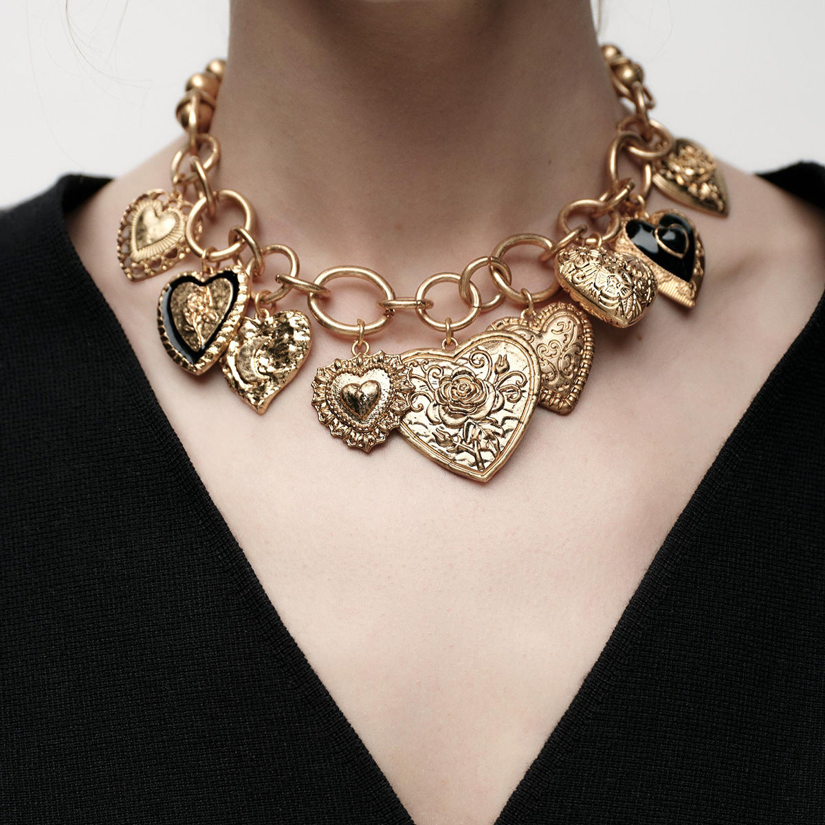 Gold-tone charm necklace with embossed heart pendants - Alginu