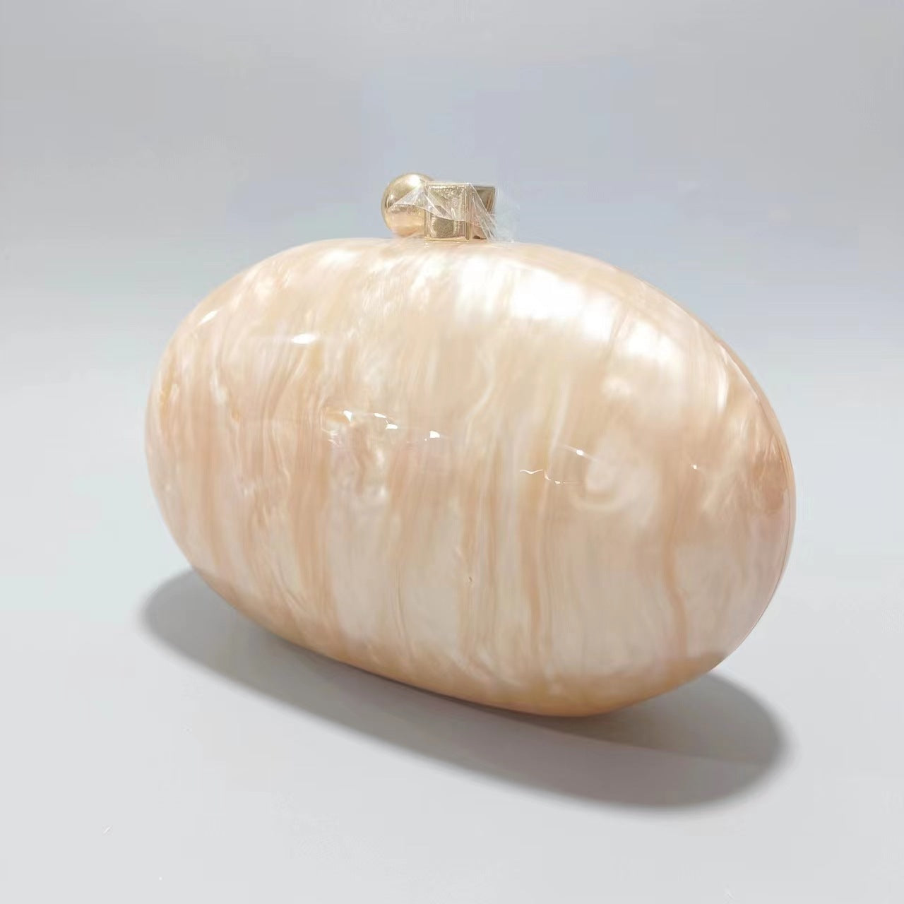 Oval marble clutch with gold clasp and chain handle - Zigru