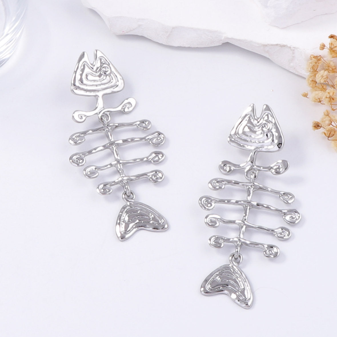 geometric statement earrings with tribal fishbone motif – ORA