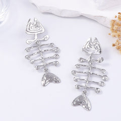 geometric statement earrings with tribal fishbone motif – ORA
