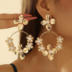floral hoop earring with blue crystal centers – AURELIA