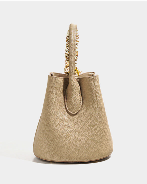 pebble-textured bucket bag with printed scarf detail - NORPA