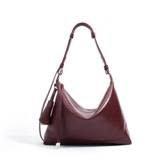 slouchy leather shoulder bag with minimalist charm – NOVIR