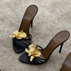 black stiletto mules with gold sculpted flower – CALISTA