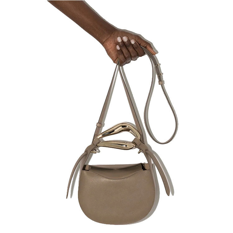 sculptural-handle saddle bag in tan leather – ARIS