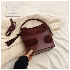suede bucket bag with curved leather trim – RUBY