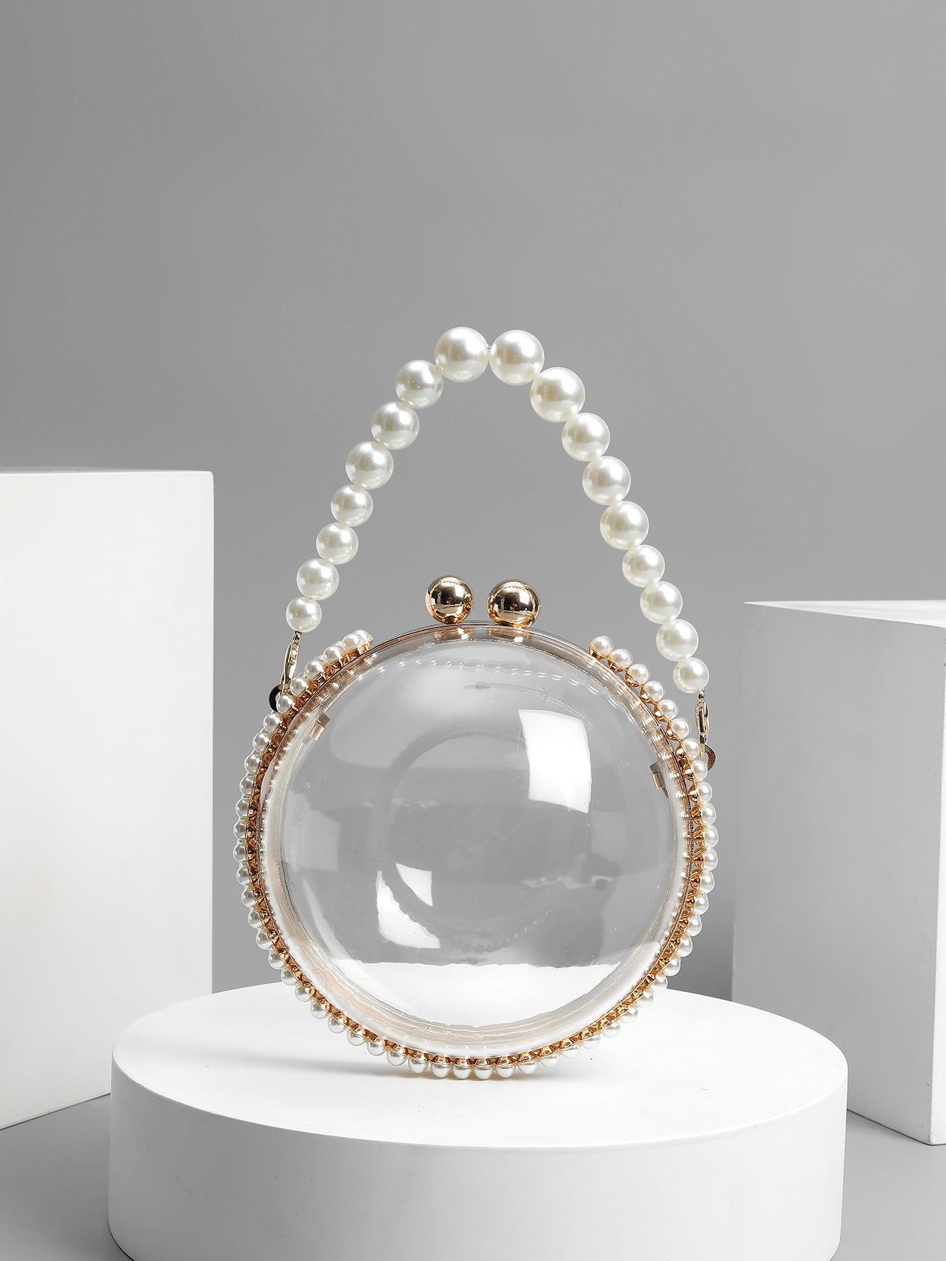 Circular clear bag with pearl handle and rhinestone accents - Lildu