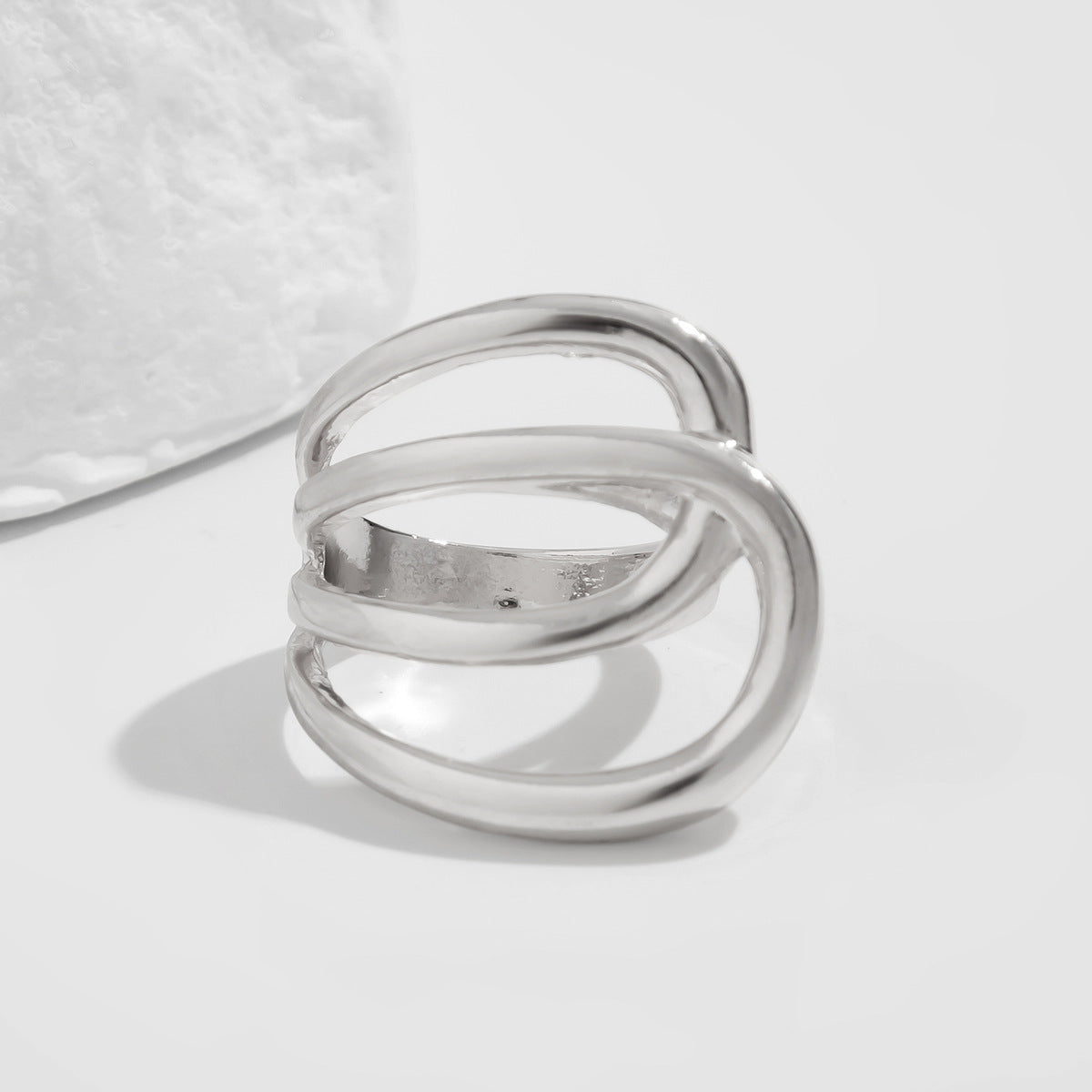Open triple-loop statement ring with sculptural curve - Nulgi