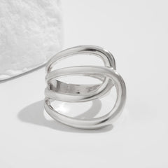 Open triple-loop statement ring with sculptural curve - Nulgi