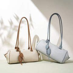 barrel-shaped shoulder bag with twin charm detail – LILURA