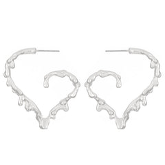 Molten heart-shaped hoop earrings with sculpted texture - Lamno